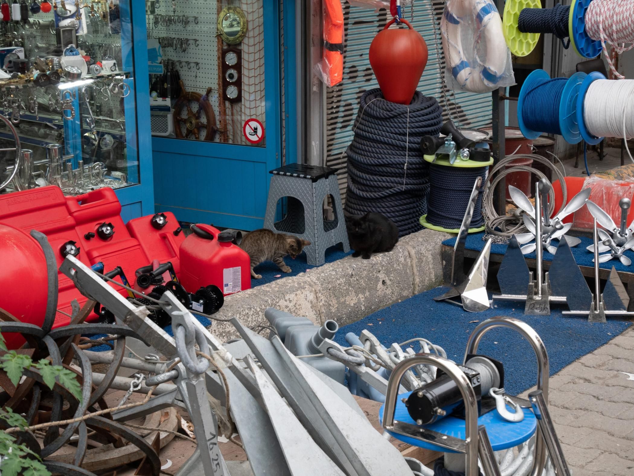 sea river site shop market with ship boat sail accessories like anchors, cables, ropes, buoy, beacons